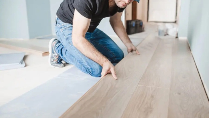 The man fixing the wooden board at Michigan